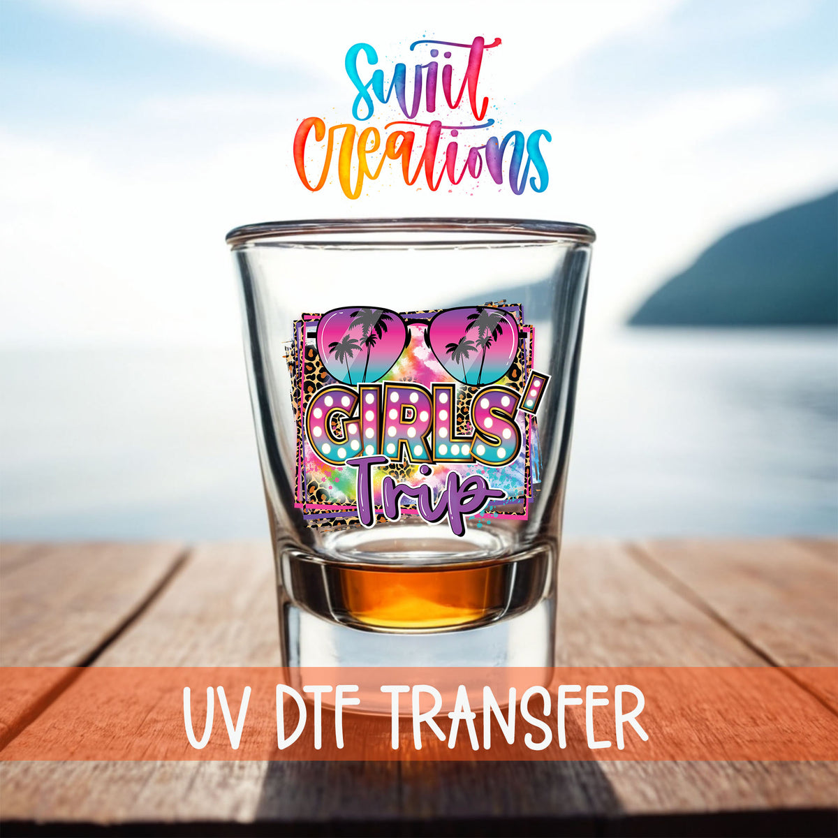Girls Trip shot glass UV DTF transfer on a filled shot glass on a dock by the water