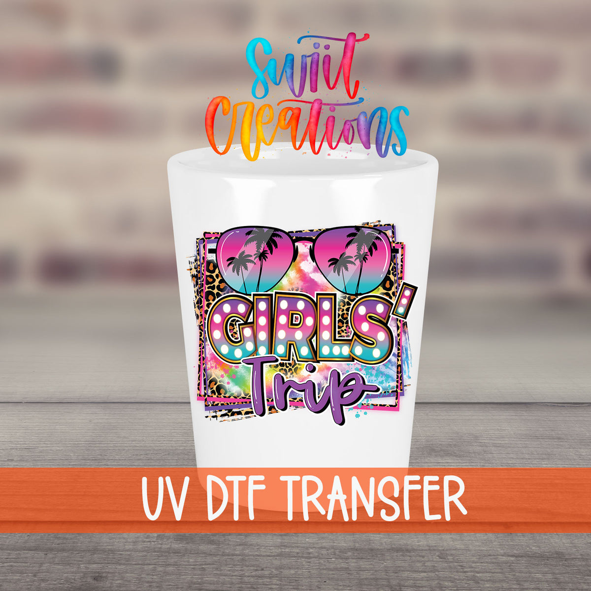 Girls Trip UV DTF transfer on a white shot glass in front of a brick wall