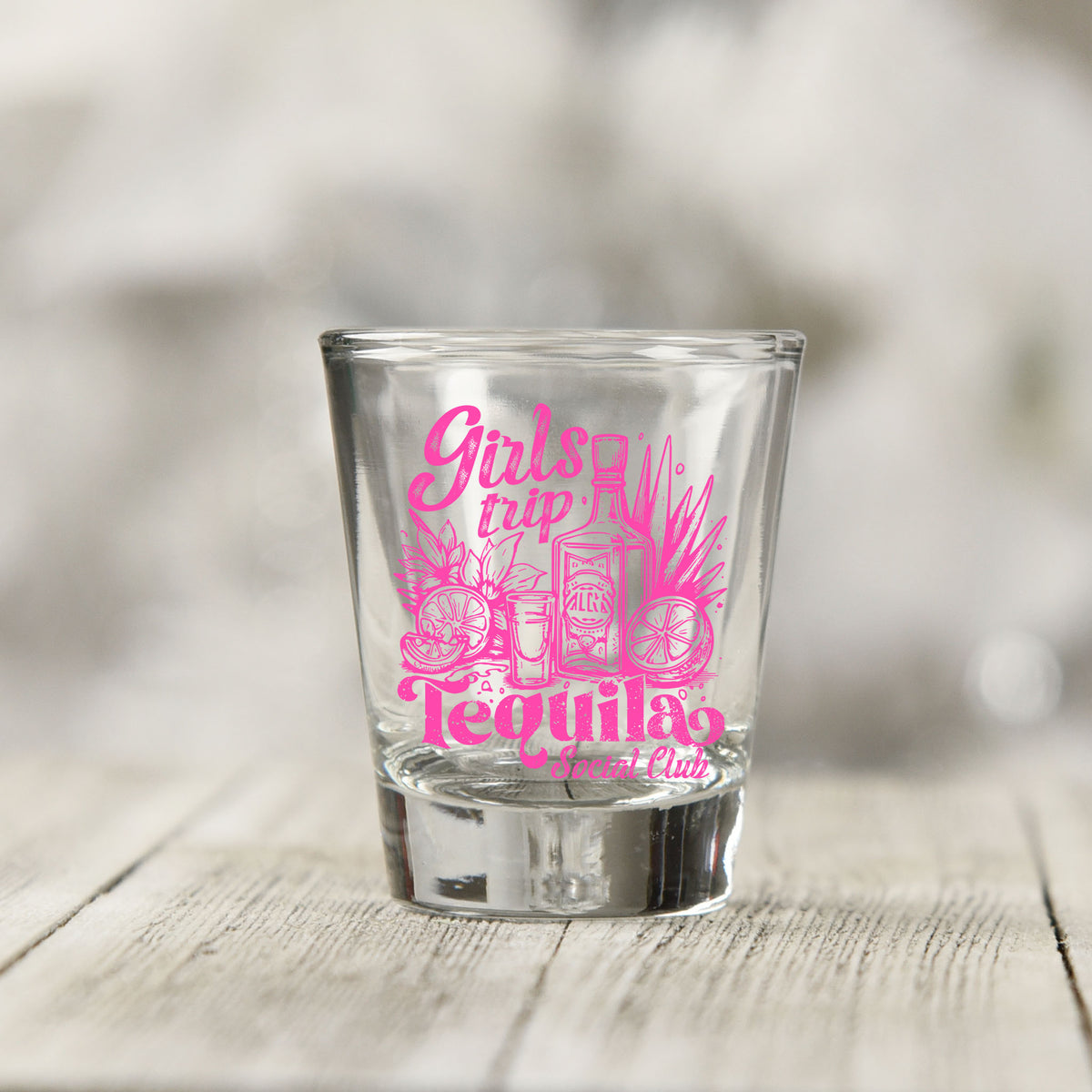 Close-up of the Girls Trip Tequila UV DTF transfer on a clear shot glass