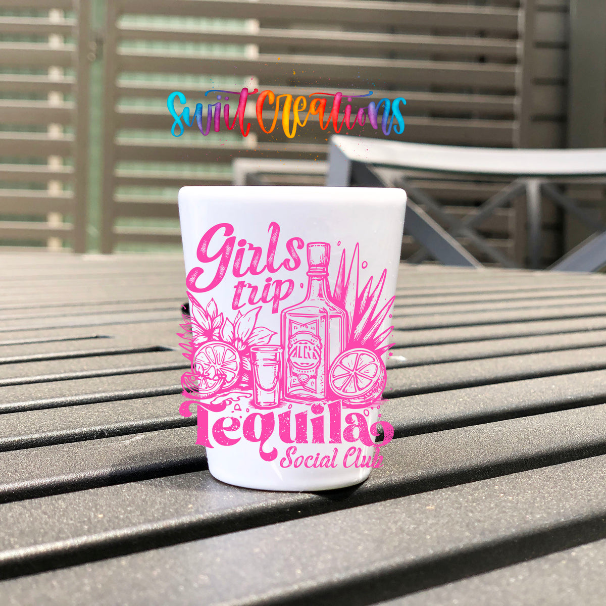 Girls Trip Tequila UV DTF transfer on a white shot glass on an outdoor patio table
