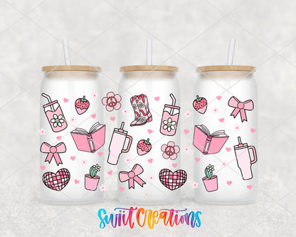 Girly Pink UV DTF wrap on three frosted glass cans