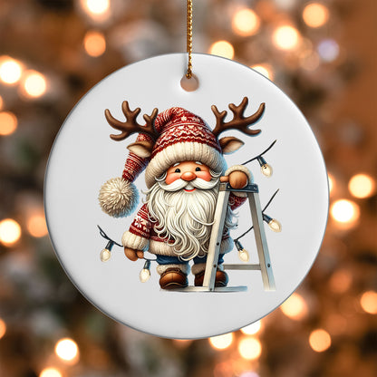 Gnome Hanging Christmas Lights ornament UV DTF transfer on a round white ornament with a bokeh light background
