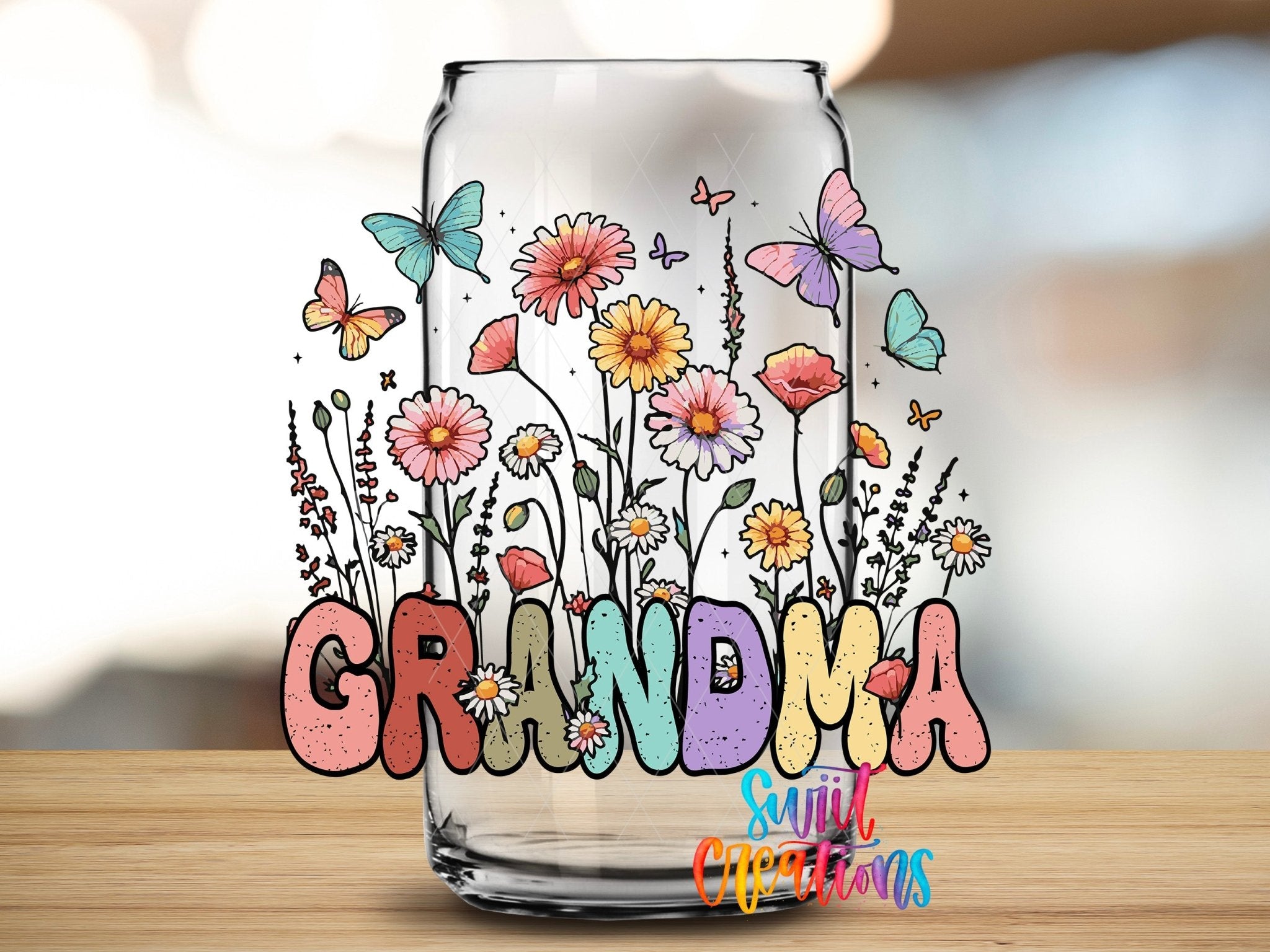 Grandma Floral Wildflower UV DTF transfer applied to a clear glass can from Swiit Creations