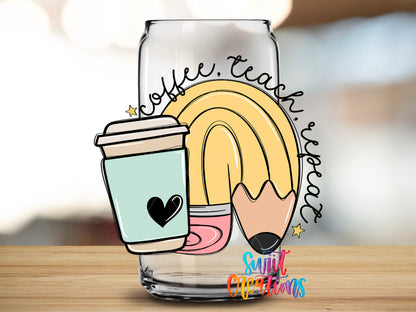 Coffee Teach Repeat design close-up on a clear glass can tumbler