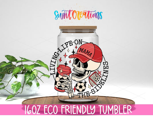 Soccer Mama Living Life on the Sidelines design on a 16 oz clear glass tumbler with bamboo lid
