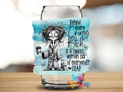 Behind Every Crazy Bitch design close-up on a clear glass can tumbler