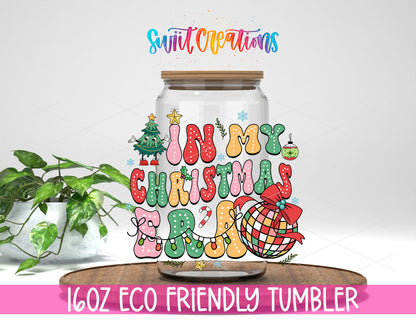 In My Christmas Era design on a 16 oz clear glass tumbler with bamboo lid