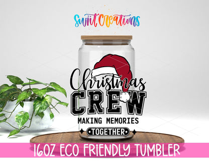 Christmas Crew design on a 16 oz clear glass tumbler with bamboo lid