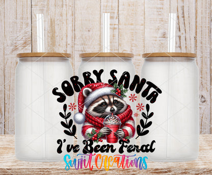 Sorry Santa I Have Been Feral Raccoon frosted glass tumbler mockup with bamboo lids and straws