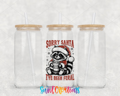 Sorry Santa Feral Raccoon clear glass tumbler group mockup with bamboo lids and straws