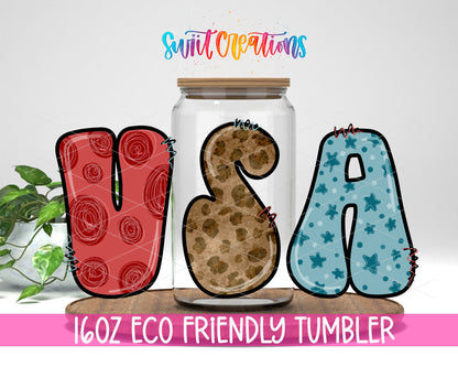 USA Patterned Letters design on a 16 oz clear glass tumbler with bamboo lid