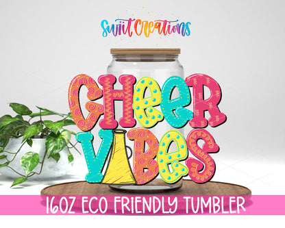 Cheer Vibes design on a 16 oz clear glass tumbler with bamboo lid