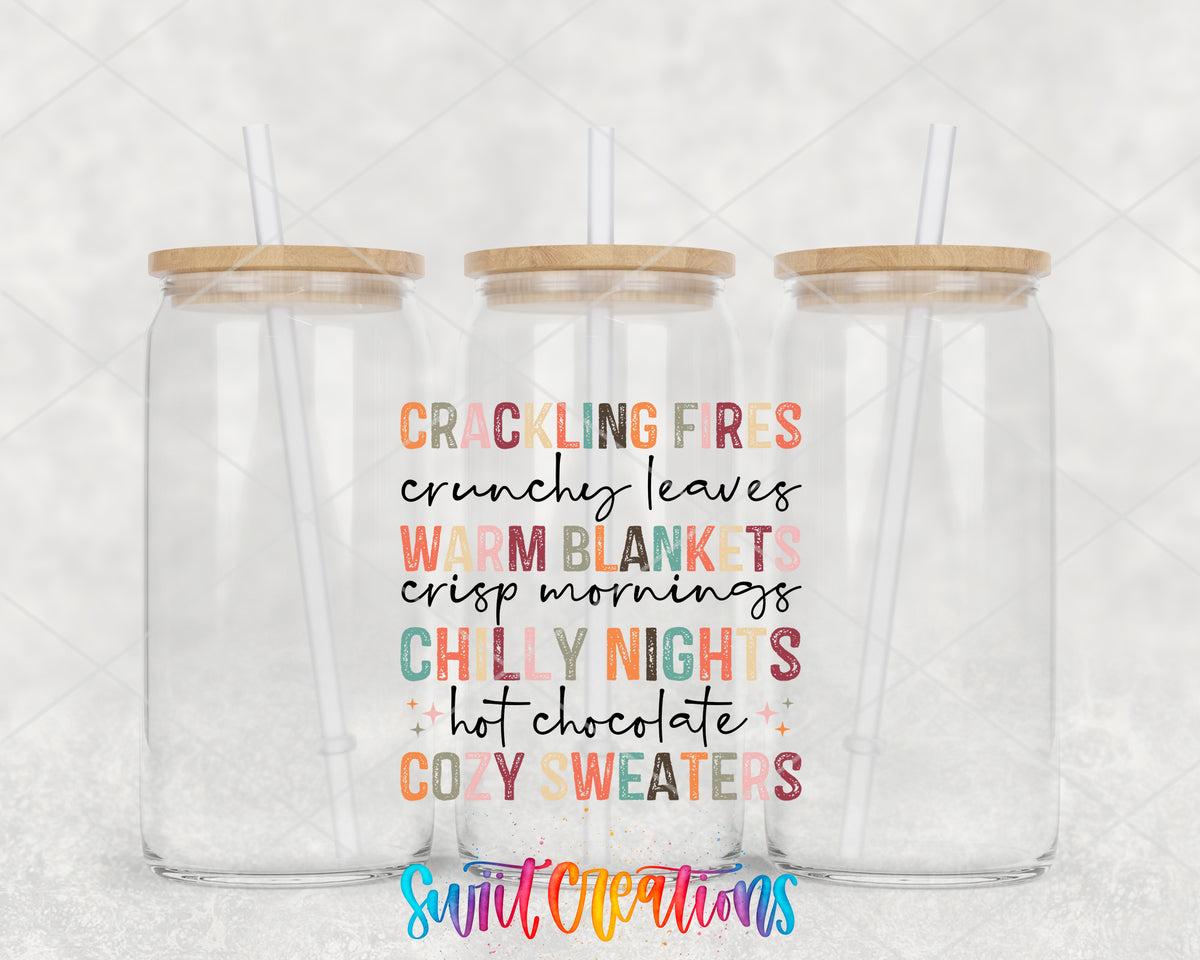 Crackling Fires Cozy Sweaters clear glass tumbler group mockup with bamboo lids and straws