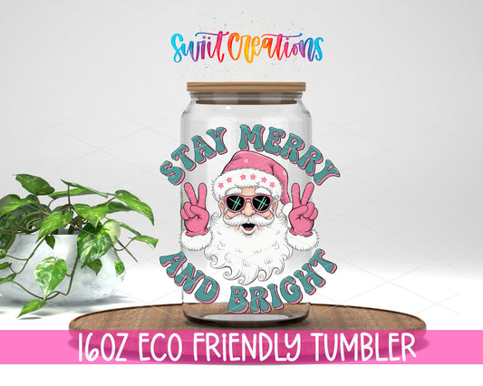 Stay Merry and Bright Santa design on a 16 oz clear glass tumbler with bamboo lid