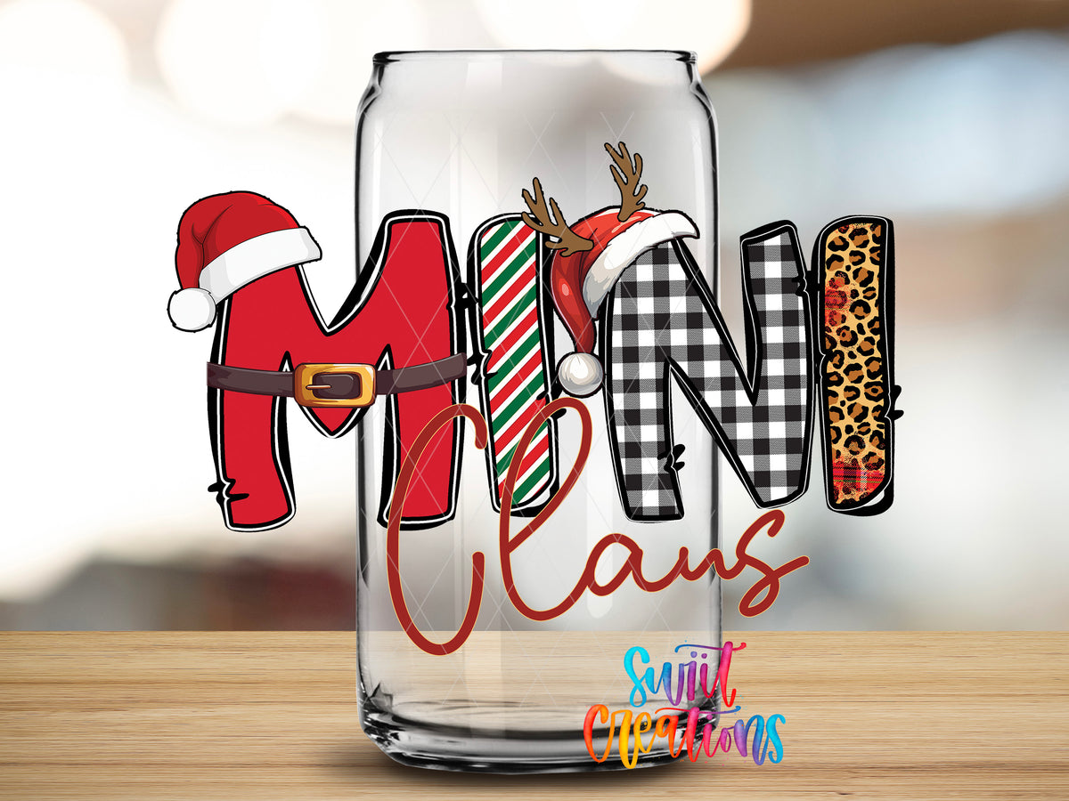 Mini Claus design close-up on a clear glass can tumbler