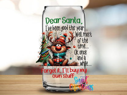 Dear Santa I'll Buy My Own Stuff design close-up on a clear glass can tumbler