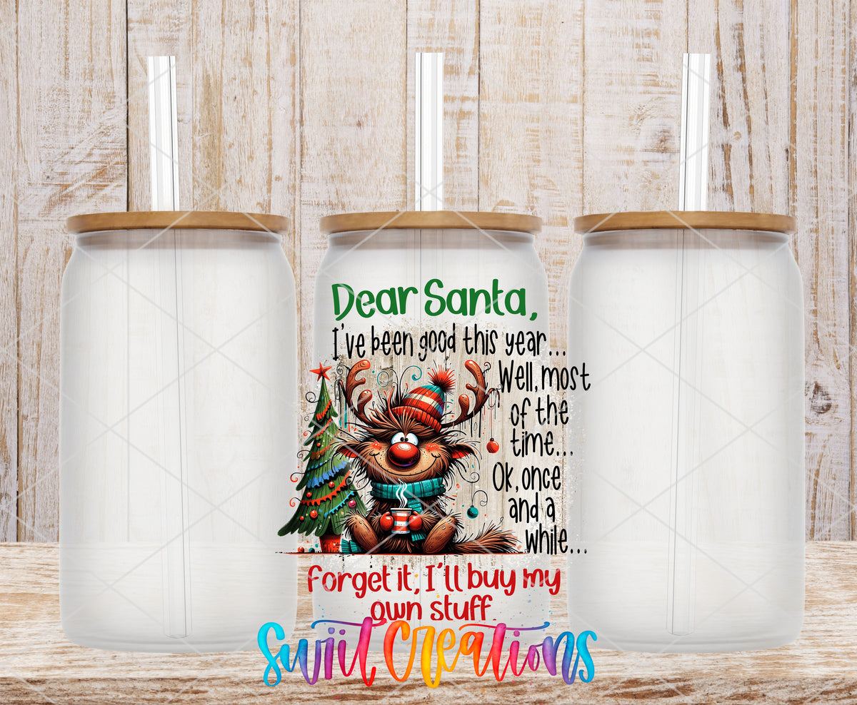 Dear Santa I'll Buy My Own Stuff frosted glass tumbler mockup with bamboo lids and straws