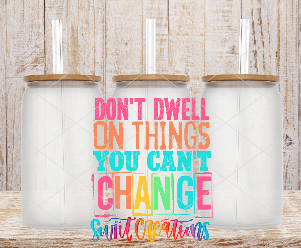 Don't Dwell on Things You Can't Change frosted glass tumbler mockup with bamboo lids and straws