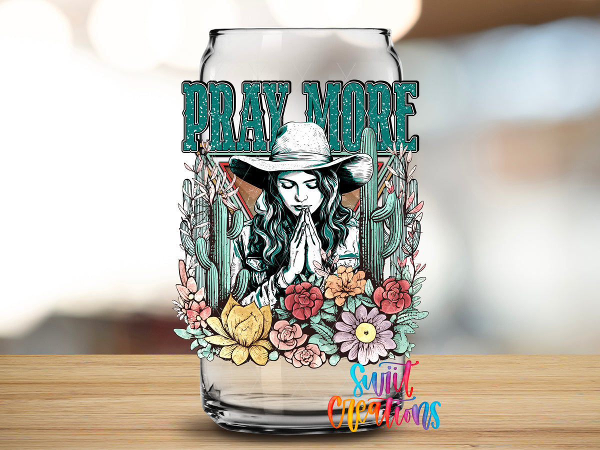 Pray More design close-up on a clear glass can tumbler