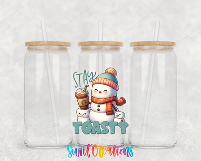 Stay Toasty Snowman clear glass tumbler group mockup with bamboo lids and straws