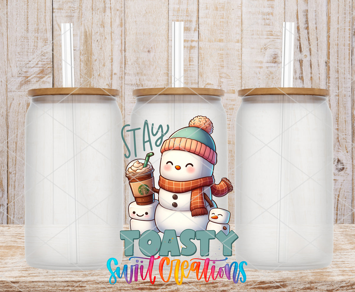 Stay Toasty Snowman frosted glass tumbler mockup with bamboo lids and straws