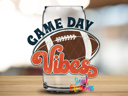 Football Game Day Vibes design close-up on a clear glass can tumbler