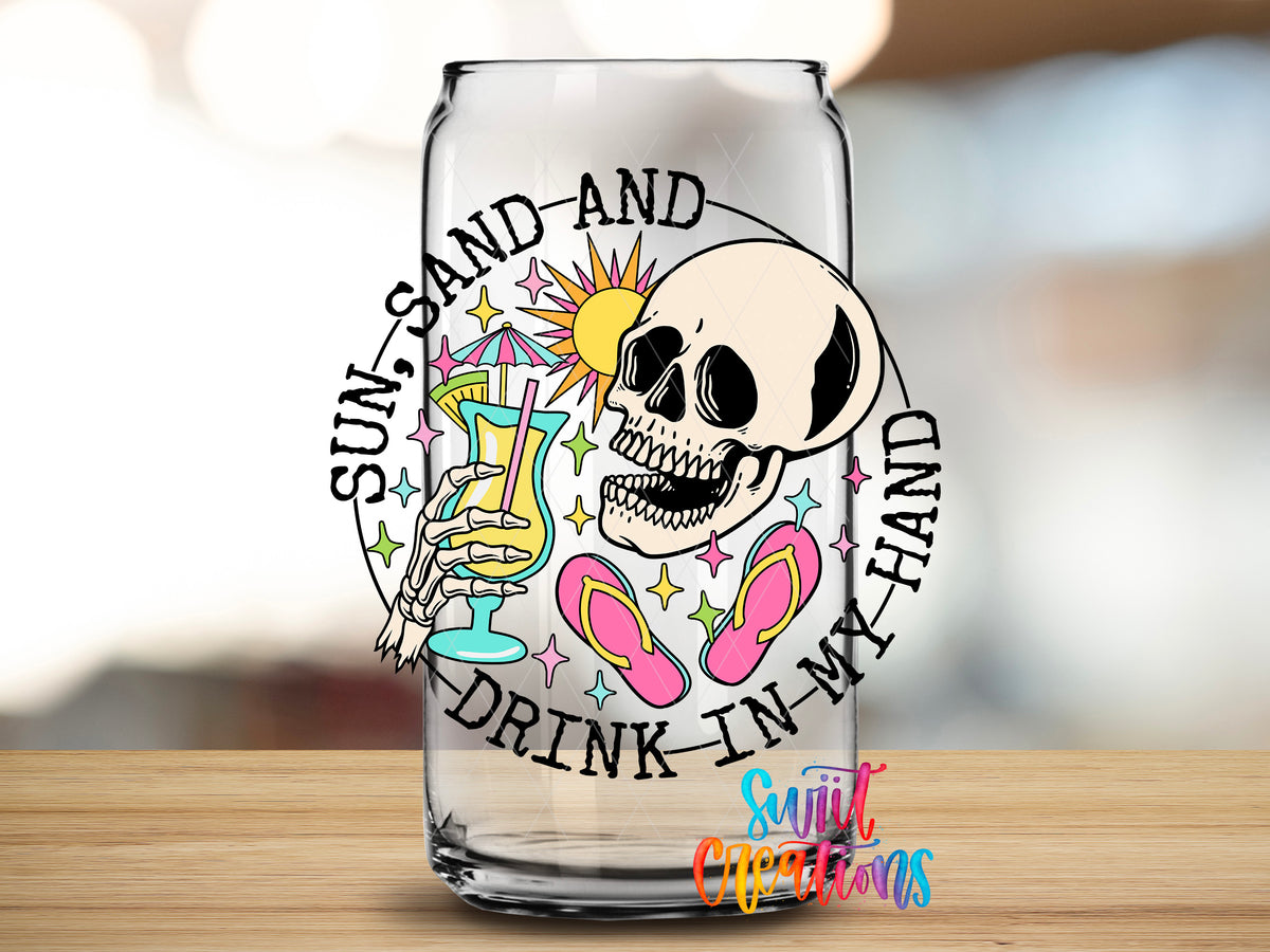 Sun Sand and Drink in My Hand design close-up on a clear glass can tumbler