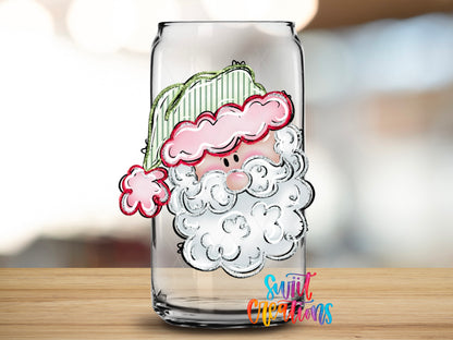 Pastel Santa design close-up on a clear glass can tumbler