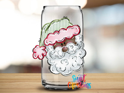 Black Santa design close-up on a clear glass can tumbler