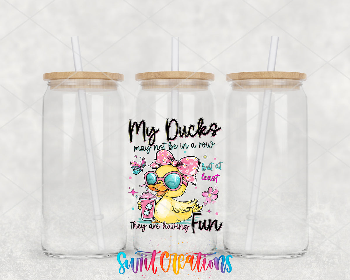 My Ducks May Not Be in a Row clear glass tumbler group mockup with bamboo lids and straws