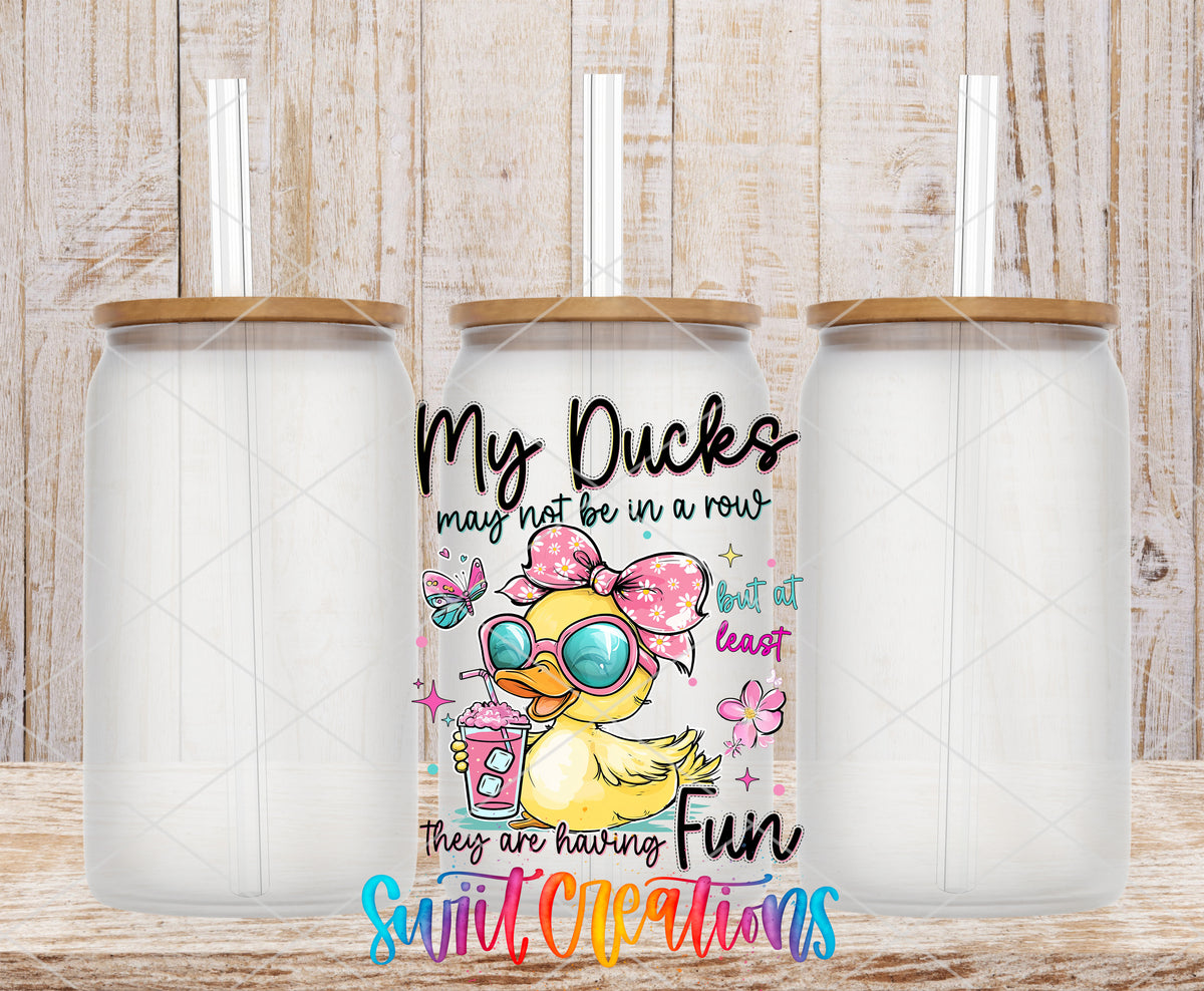 My Ducks May Not Be in a Row frosted glass tumbler mockup with bamboo lids and straws
