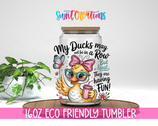 My Ducks May Not Be in a Row design on a 16 oz clear glass tumbler with bamboo lid