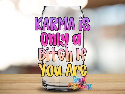 Karma Is a Bitch design close-up on a clear glass can tumbler