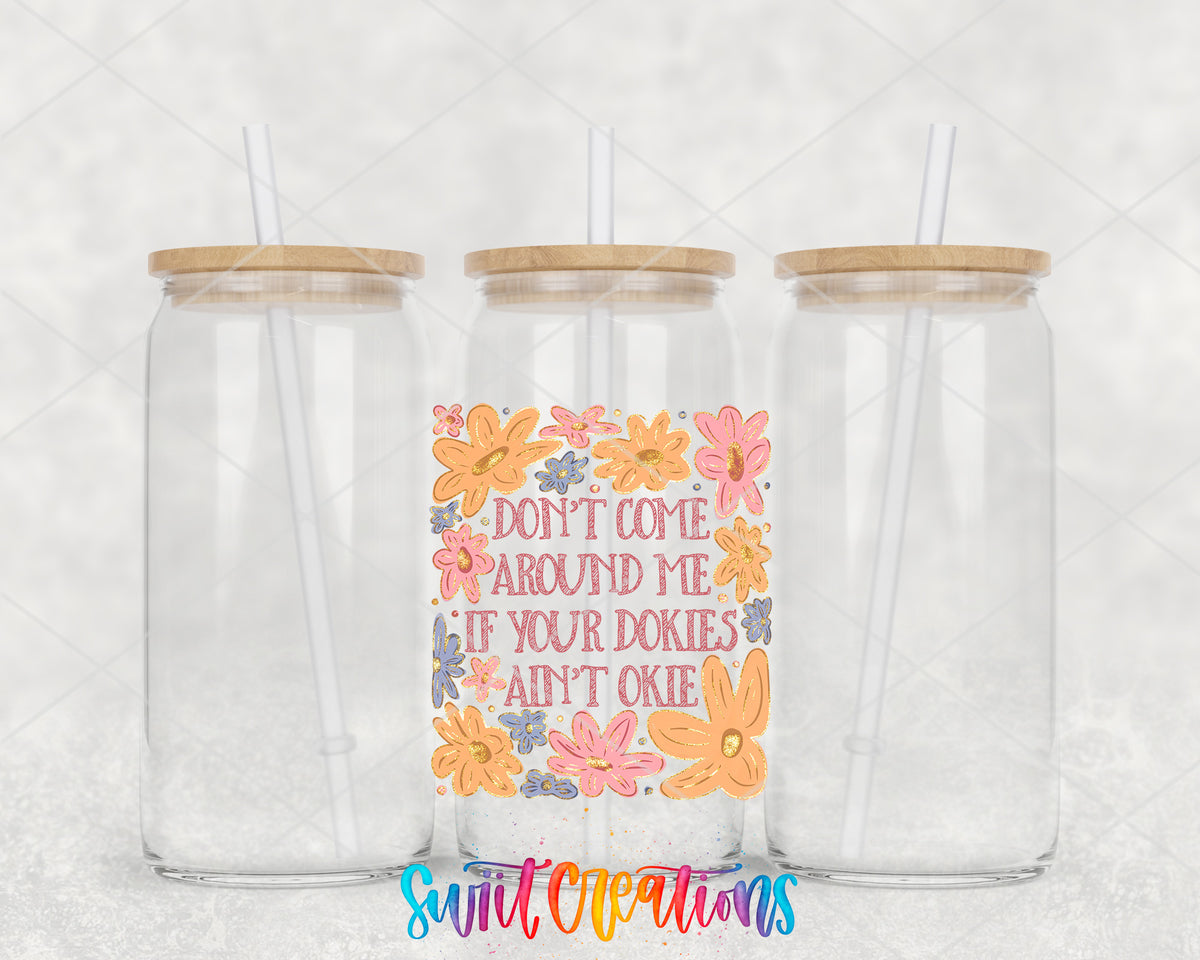 Dookies Ain't Okie clear glass tumbler group mockup with bamboo lids and straws