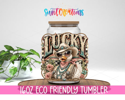 Western Glam Lucky Duck design on a 16 oz clear glass tumbler with bamboo lid