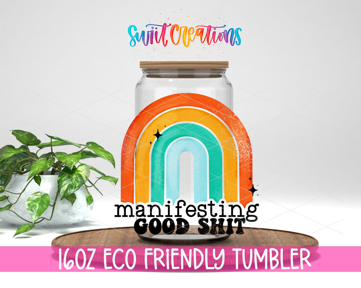 Manifesting Good Shit design on a 16 oz clear glass tumbler with bamboo lid