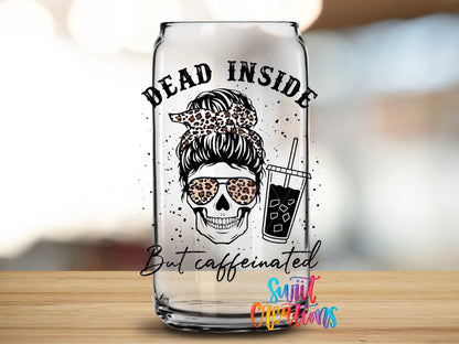 Dead Inside But Caffeinated design close-up on a clear glass can tumbler