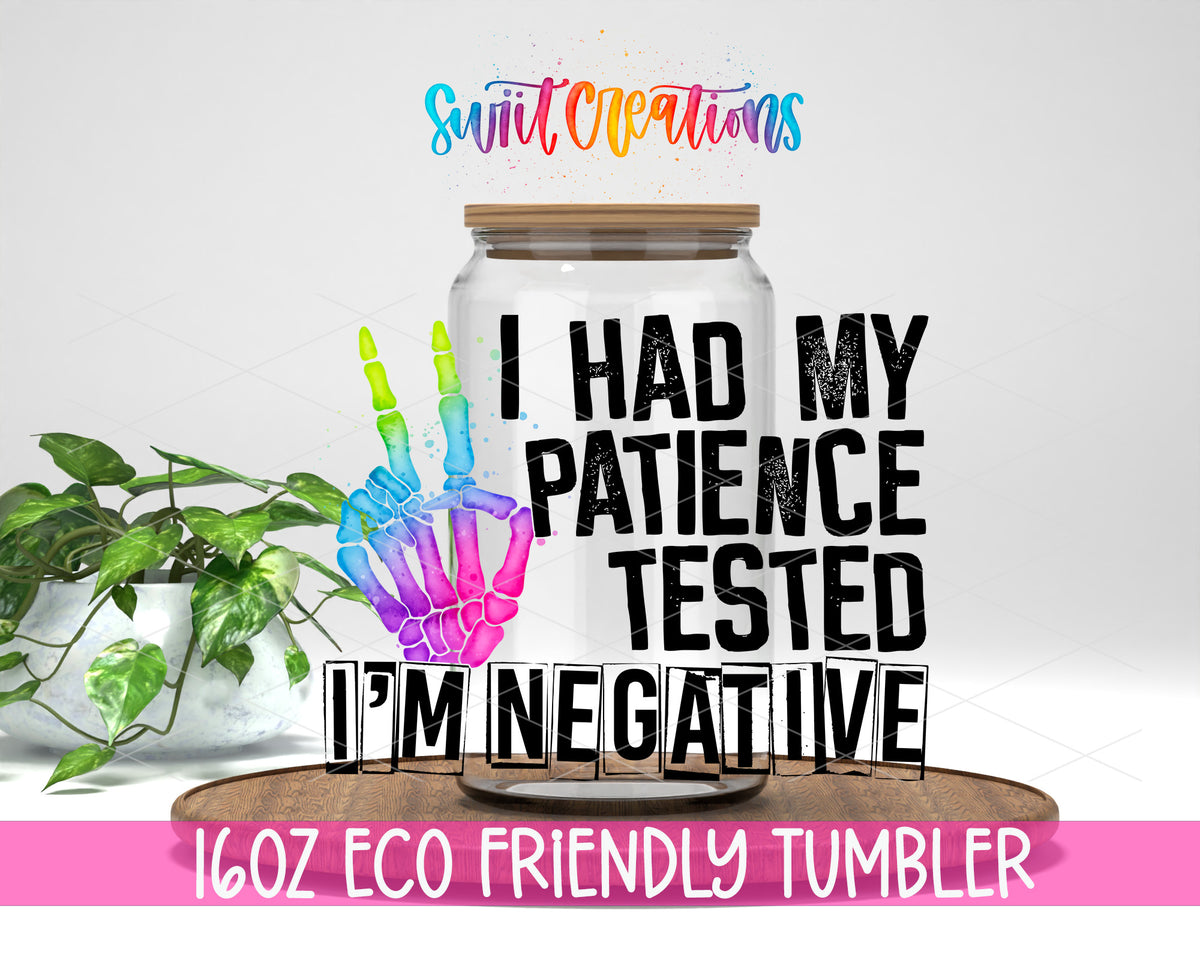 Patience Tested I Am Negative design on a 16 oz clear glass tumbler with bamboo lid