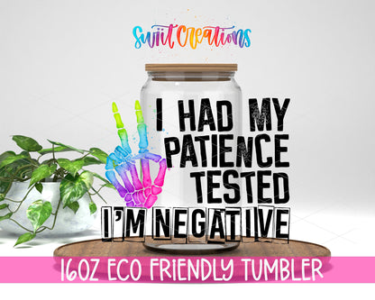 Patience Tested I Am Negative design on a 16 oz clear glass tumbler with bamboo lid