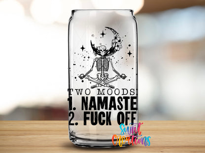 Two Moods Namaste design close-up on a clear glass can tumbler