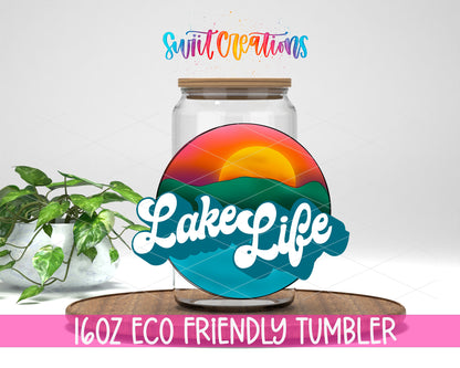 Sunset Lake Life design on a 16 oz clear glass tumbler with bamboo lid