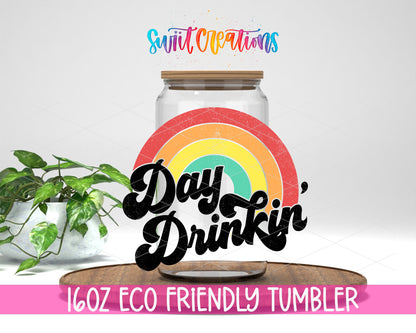 Day Drinkin Rainbow design on a 16 oz clear glass tumbler with bamboo lid