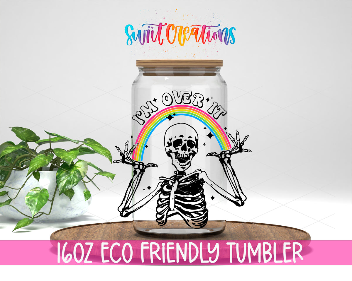 I Am Over It Skeleton design on a 16 oz clear glass tumbler with bamboo lid