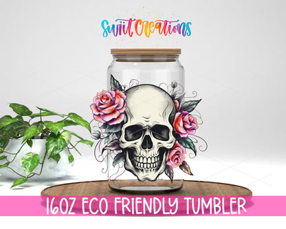 Pink Rose Floral Skull design on a 16 oz clear glass tumbler with bamboo lid