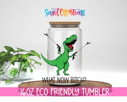 What Now Dinosaur design on a 16 oz clear glass tumbler with bamboo lid