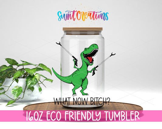 What Now Dinosaur design on a 16 oz clear glass tumbler with bamboo lid