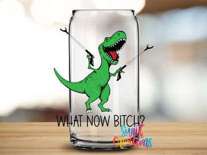 What Now Dinosaur design close-up on a clear glass can tumbler