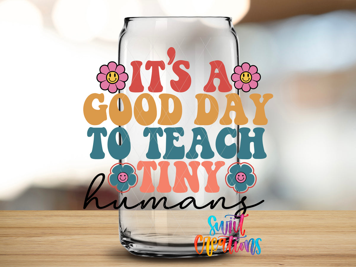 Good Day to Teach Tiny Humans design close-up on a clear glass can tumbler