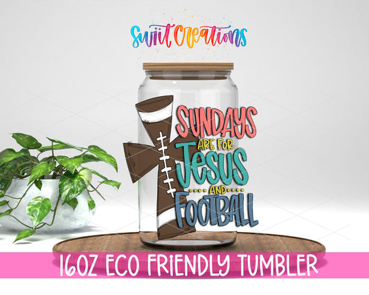 Sundays Jesus and Football design on a 16 oz clear glass tumbler with bamboo lid