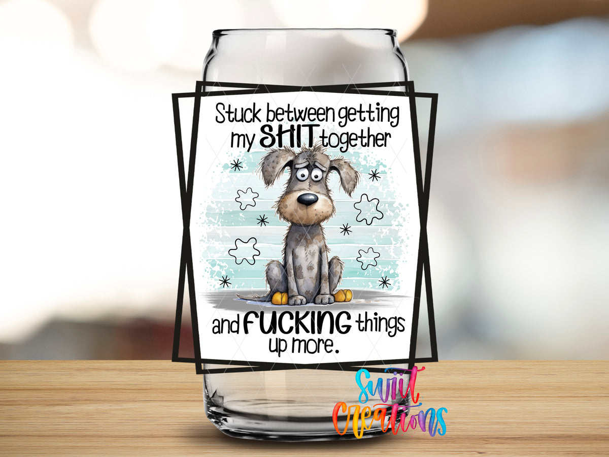 Stuck Between Getting It Together design close-up on a clear glass can tumbler
